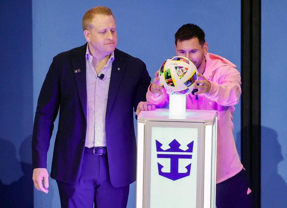 Lionel Messi places a soccer ball on a pedestal during the official naming ceremony on board the Royal Caribbean International’s Icon of the Seas in the Aquatheater as Royal Caribbean Group President and CEO Jason Liberty looks on while docked at the Port of Miami in Miami, Florida on Tuesday, January 23, 2024.