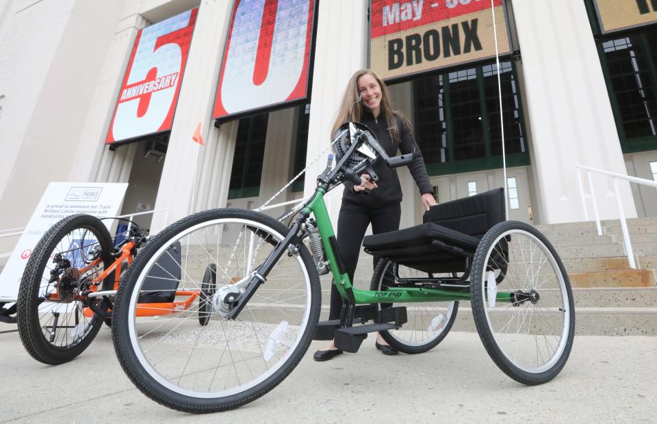 Erin Cordiner of the Westchester Parks Foundation shows one of six hand cycles that the group will make available for use by participants in Bicycle Sundays during a press conference at the Westchester County Center in White Plains May 3, 2024. This year's event will be the 50th anniversary of Bicycle Sundays on the Bronx River Parkway.
