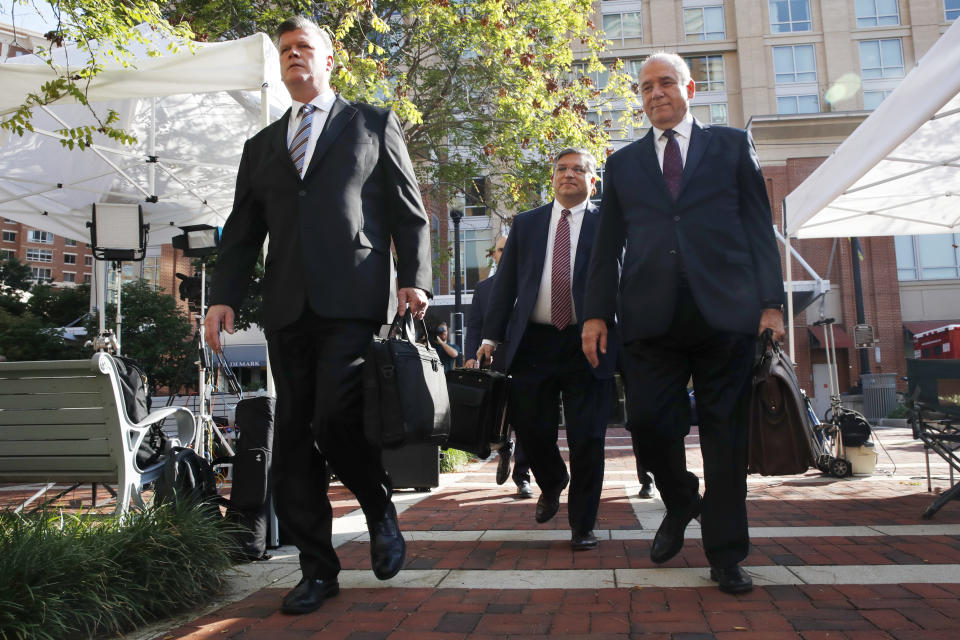 Members of the defense team for Paul Manafort, from left, Kevin Downing, Richard Westling, and Thomas Zehnle, walk to federal court for closing arguments in the trial of the former Trump campaign chairman, in Alexandria, Va., Wednesday, Aug. 15, 2018. (AP Photo/Jacquelyn Martin)