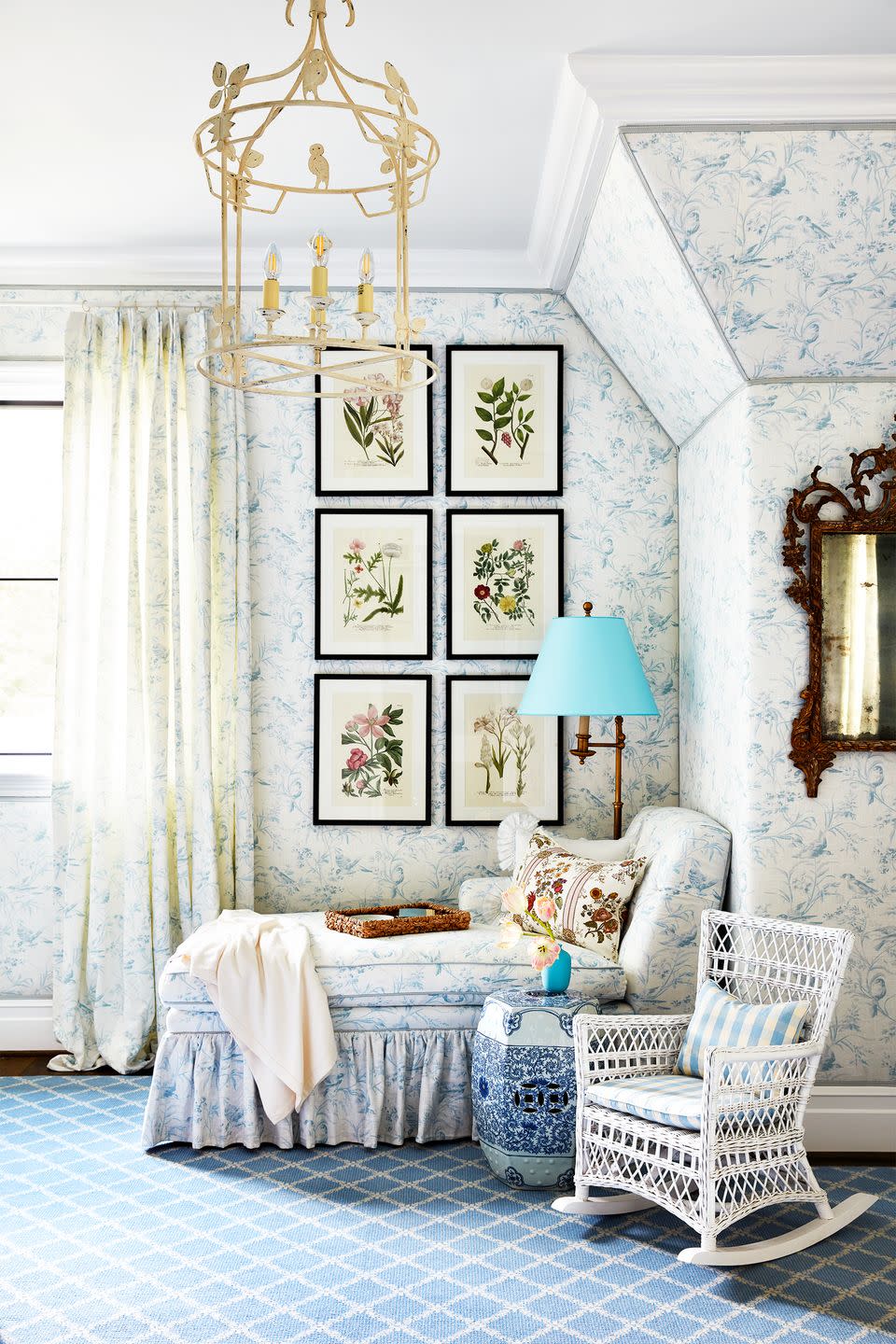 <p>Who says gender neutral nurseries can't also boast traditional decor? A sweet shade of blue, along with whimsical patterns, and delicate furniture is a go-to for a reason. <a href="https://www.housebeautiful.com/room-decorating/a29342573/whole-home-2019-kids-rooms/" rel="nofollow noopener" target="_blank" data-ylk="slk:Amy Berry;elm:context_link;itc:0;sec:content-canvas" class="link ">Amy Berry</a> incorporated a chaise and rocking chair for reading and brought the room to life with a classic toile wallpaper and framed botanical prints. It's a lovely place for any baby to grow.</p>