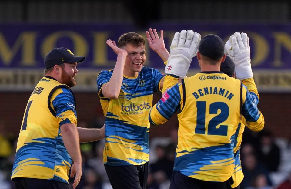 Birmingham Bears’ Henry Brooks, centre, celebrates the wicket of Luis Reece (Tim Goode/PA) (PA Wire)