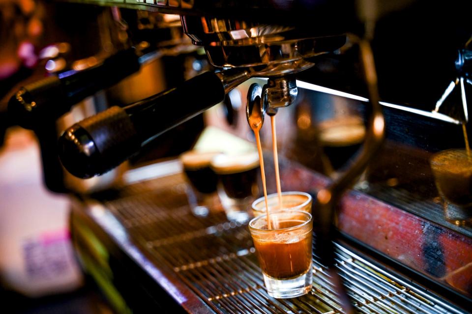 Espresso pours into cups for drinks at The Hob Nob coffee shop on Monday, Oct. 2, 2023, in downtown Lansing.