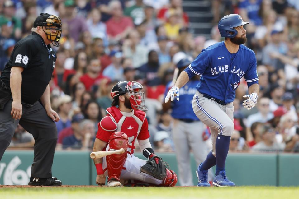 Toronto Blue Jays' Brandon Belt, right, runs on his solo home run in front of Boston Red Sox catcher Connor Wong, center, during the third inning of a baseball game, Saturday, Aug. 5, 2023, in Boston. (AP Photo/Michael Dwyer)