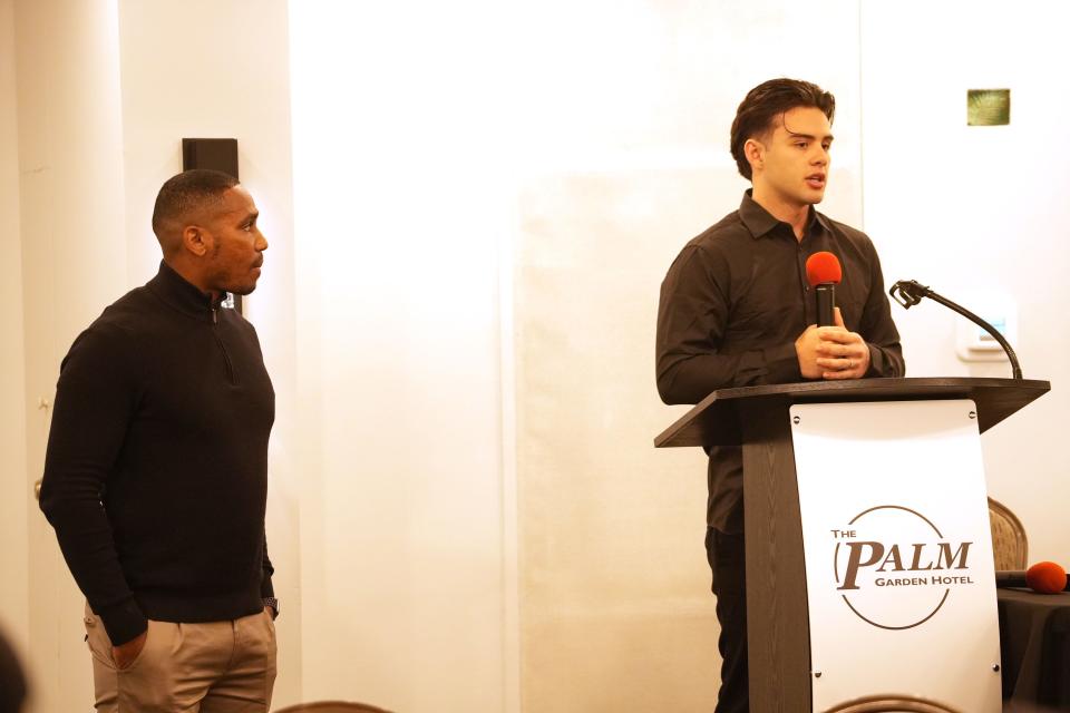 Calabasas High's Alonzo Contreras talks about his commitment as head coach Cary Harris listens during the Ventura County Football Coaches Association's Signing Day Luncheon at the Palm Garden Hotel in Newbury Park on Wednesday, Feb. 7, 2024. Contreras signed with San Jose State.