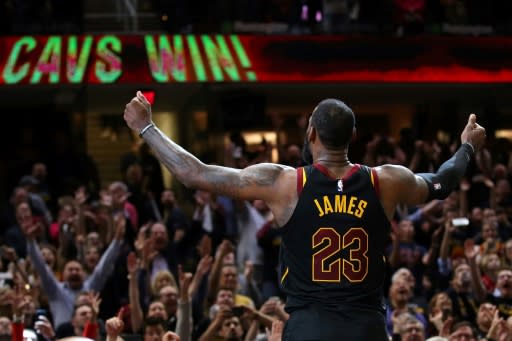 LeBron James of the Cleveland Cavaliers celebrates after hitting the game winning shot to beat the Toronto Raptors 105-103 in game three