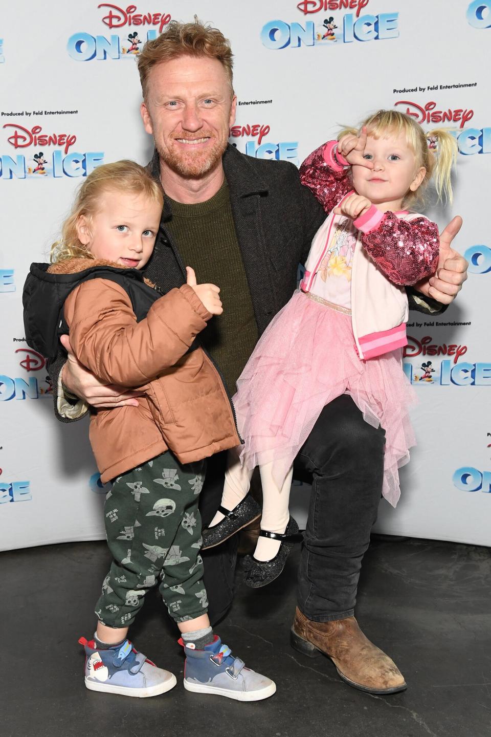 Kevin McKidd (C) and kids arrive as Disney On Ice presents Road Trip Adventures at Crypto.com Arena on December 09, 2022 in Los Angeles, California.