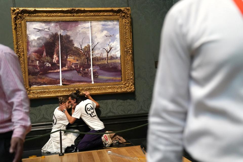 The protesters glued their hands to the frame of John Constable’s The Hay Wain (Kirsty O’Connor/PA) (PA Wire)