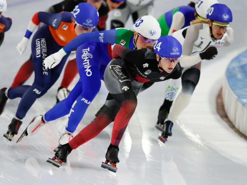 Canada's Ivanie Blondin, centre, shown in a file photo at the speed skating World Championships in February, won the women's mass start event at the ISU speed skating World Cup in Salt Lake City, Utah on Sunday. (Peter Dejong/AP Photo - image credit)