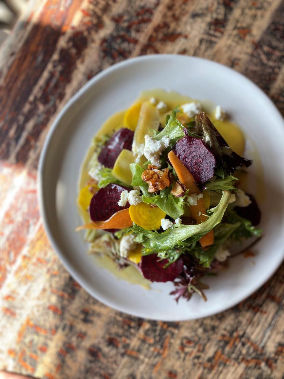 Morristown's South + Pine restaurant's beet and carrot salad, with honey roasted almonds, ginger and goat cheese.