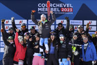 United States' Mikaela Shiffrin, center, celebrates with her team after taking second place in an alpine ski, women's World Championships super G, in Meribel, France, Wednesday, Feb. 8, 2023. (AP Photo/Marco Trovati)