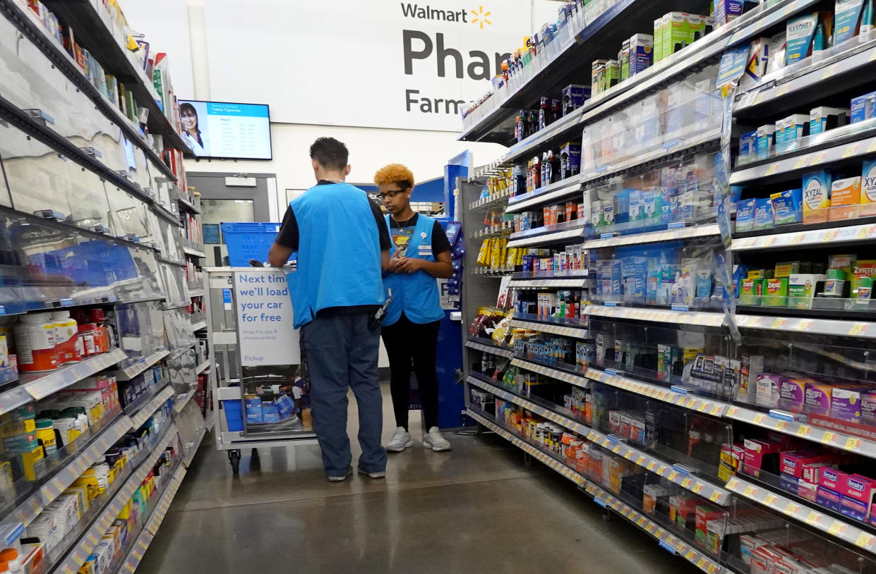 MIAMI, FLORIDA - JANUARY 24: Workers stock the shelves at a Walmart store on January 24, 2023 in Miami, Florida. Walmart
announced that it is raising its minimum wage for store employees in early March, store employees will make between $14 and $19 an hour. They currently earn between $12 and $18 an hour. (Photo by Joe Raedle/Getty Images)