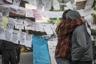 <p>Family members of the Enrique Rebsamen school victims embrace one day after the magnitude 7.1 earthquake jolted central Mexico damaging buildings, knocking out power and causing alarm throughout the capital on Sept. 20, 2017 in Mexico City, Mexico. (Photo: Christian Palma/Getty Images) </p>