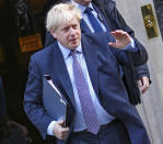 British Prime Minister Boris Johnson leaves 10 Downing Street, to go to the Houses of Parliament in London, Saturday, Oct. 19, 2019. Britain's Parliament is set to vote in a rare Saturday sitting on Prime Minister Boris Johnson's new deal with the European Union, a decisive moment in the prolonged bid to end the Brexit stalemate. Various scenarios may be put in motion by the vote. (AP Photo/Vudi Xhymshiti)