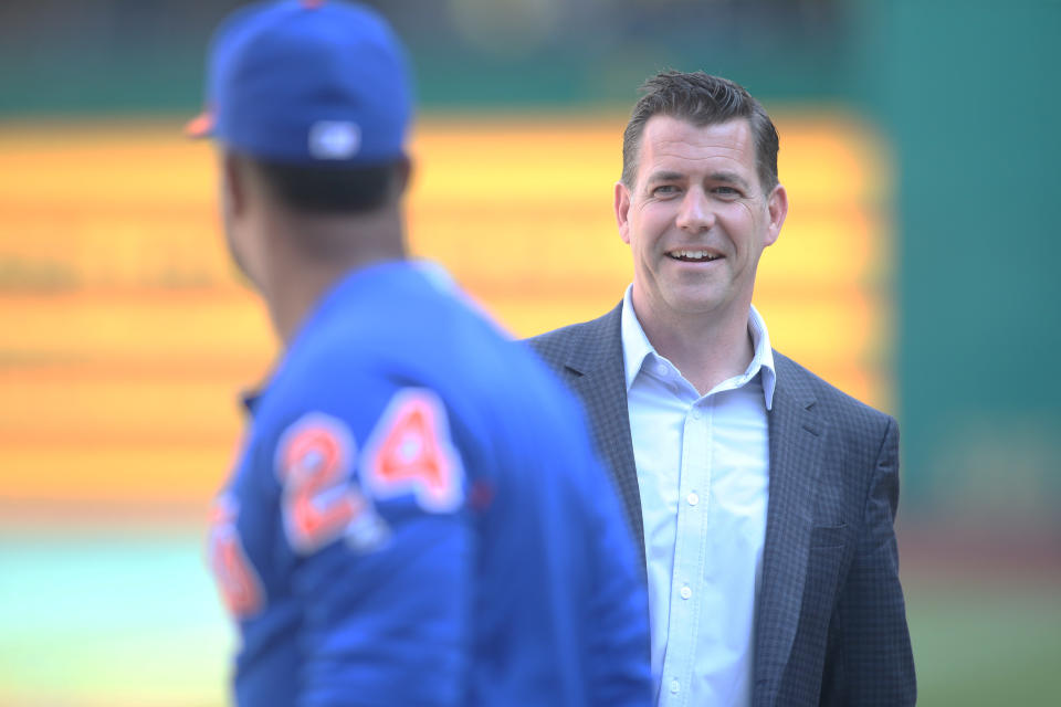 Aug 3, 2019; Pittsburgh, PA, USA; New York Mets general manager Brodie Van Wagenen (right) talks with second baseman Robinson Cano (left) during batting practice before a game against the Pittsburgh Pirates at PNC Park. Mandatory Credit: Charles LeClaire-USA TODAY Sports