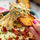 <p>We love baked spinach dip more than we like to admit. (TBH, <a href="https://www.delish.com/entertaining/g1442/super-bowl-dips/" rel="nofollow noopener" target="_blank" data-ylk="slk:we've never met a dip we didn't like" class="link ">we've never met a dip we didn't like</a>.) If it were up to us, we'd have dip for <a href="https://www.delish.com/weeknight-dinners/" rel="nofollow noopener" target="_blank" data-ylk="slk:dinner" class="link ">dinner</a>, and many of us had. And this dip is a great candidate for dip dinner. The smoky bacon bits make baked spinach dip feel a little fancier. But you can totally skip it. This dip has a lot going on with three different cheeses. <br><br>Get the <strong><a href="https://www.delish.com/cooking/recipe-ideas/recipes/a50161/bacon-spinach-dip-recipe/" rel="nofollow noopener" target="_blank" data-ylk="slk:Cheesy Bacon Spinach Dip recipe" class="link ">Cheesy Bacon Spinach Dip recipe</a></strong>. </p>