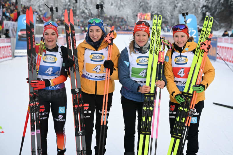 Germany's third-placed team of Janina Hettich-Walz, Sophia Schneider, Franziska Preuss and Hanna Kebinger celebrate after the Women's 4x6 km relay competition of the Biathlon World Cup in Ruhpolding. Sven Hoppe/dpa