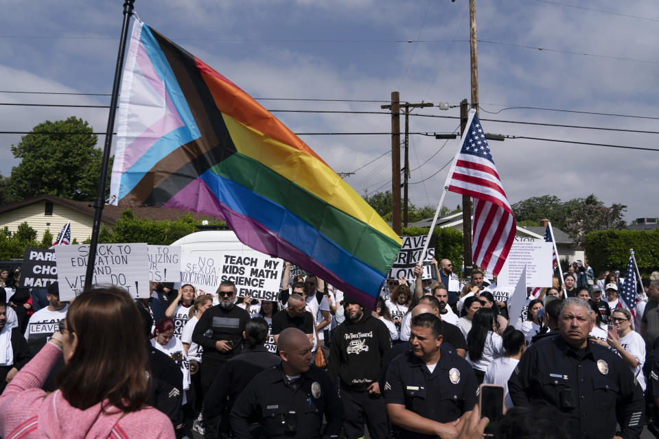 Los Angeles police officers separate protestors outside the Saticoy Elementary School in Los Angeles on Friday, June 2, 2023. Police officers separated groups of protesters and counter-protesters outside the elementary school that has become a flashpoint for Pride month events across California. (AP Photo/Jae C. Hong)