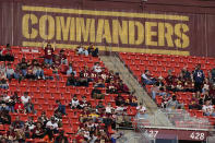 FILE - Fans watch the second half of an NFL football game between the Cleveland Browns and the Washington Commanders, Sunday, Jan. 1, 2023, at FedEx Field in Landover, Md. A group led by Josh Harris and Mitchell Rales that includes Magic Johnson has an agreement in principle to buy the NFL's Washington Commanders from longtime owner Dan Snyder for a North American professional sports team record $6 billion, according to a person with knowledge of the situation. The person spoke to The Associated Press on condition of anonymity Thursday, April 13, 2023, because the deal had not been announced. (AP Photo/Patrick Semansky, File)
