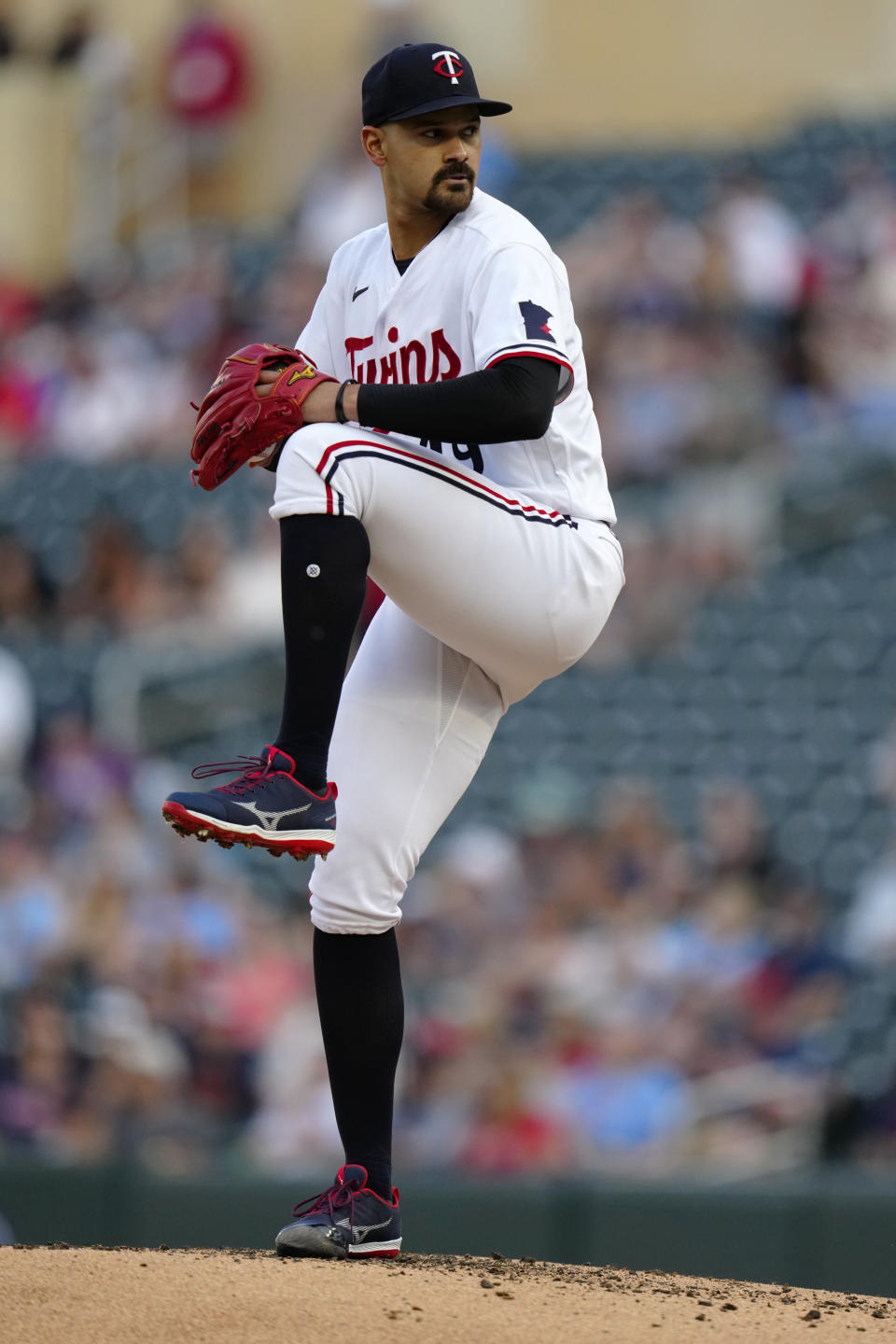 Minnesota Twins starting pitcher Pablo Lopez winds up to deliver to a Kansas City Royals batter during the second inning of a baseball game Wednesday, July 5, 2023, in Minneapolis. (AP Photo/Abbie Parr)