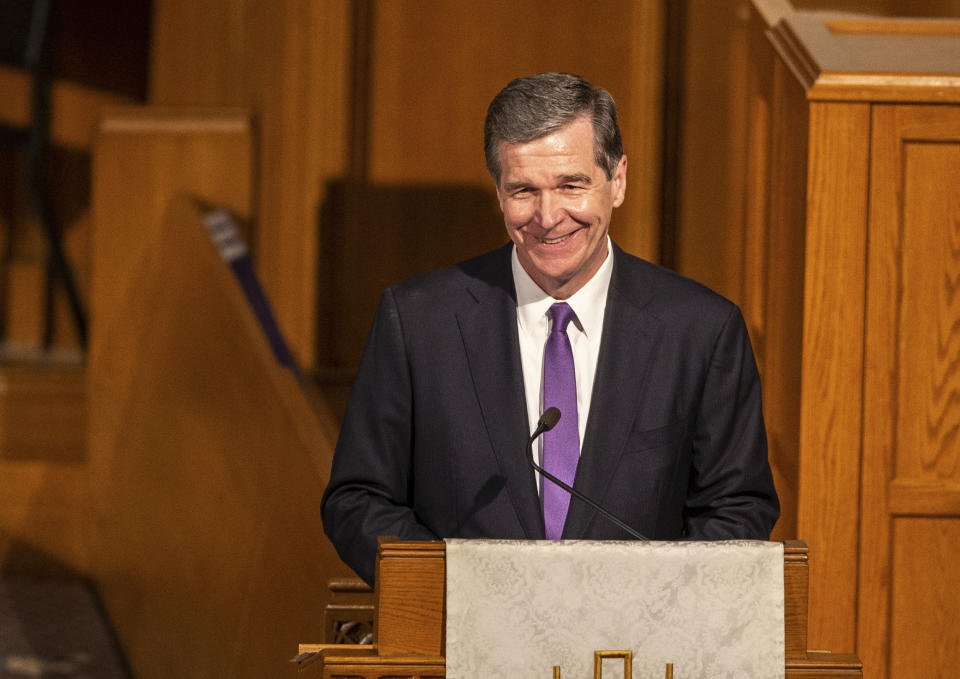 Gov. Roy Cooper speaks during the memorial service for former U.S. Sen. Kay Hagan at First Presbyterian Church, Sunday, Nov. 3, 2019, in Greensboro, N.C. Hagan died Monday, Oct. 28 of a rare virus, at the age of 66. (Khadejeh Nikouyeh/News & Record via AP)