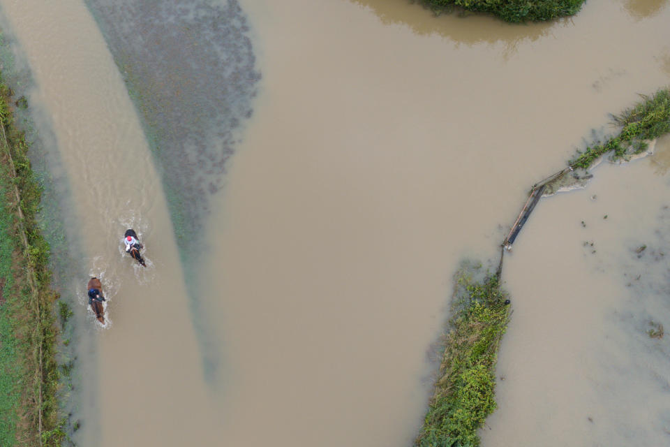 Horse riders make their way through flood water in Walton in Warwickshire. 35 flood warnings are in place across England on Tuesday morning. Parts of Bedfordshire, Oxfordshire, Warwickshire and Northamptonshire saw more than 100mm of rain in the last 48 hours. Picture date: Tuesday September 24, 2024. (Photo by Jacob King/PA Images via Getty Images)