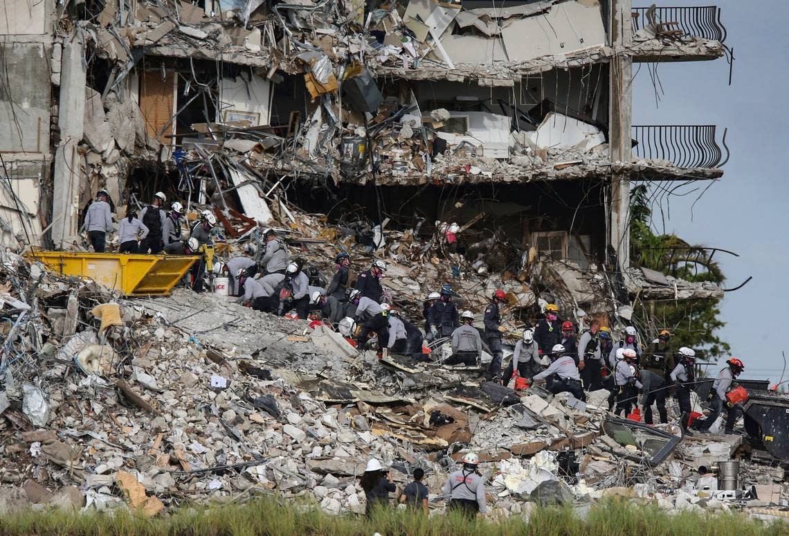 Search-and-rescue teams look for survivors at the Champlain Towers South condo on June 29, 2021, in Surfside. The condo tower partially collapsed on June 24, 2021, killing 98 people.