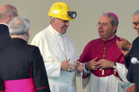 FILE - Pope Francis is flanked by Arrigo Miglio, emeritus archbishop of Cagliari, during his one day visit to the island of Sardinia, in Cagliari, Italy, Sunday, Sept. 22, 2013. Pope Francis said Sunday, May 29, 2022 he has tapped 21 churchmen to become cardinals, most of them from continents other than Europe, which has dominated Catholic hierarchy for most of the church's history. (AP Photo/File)