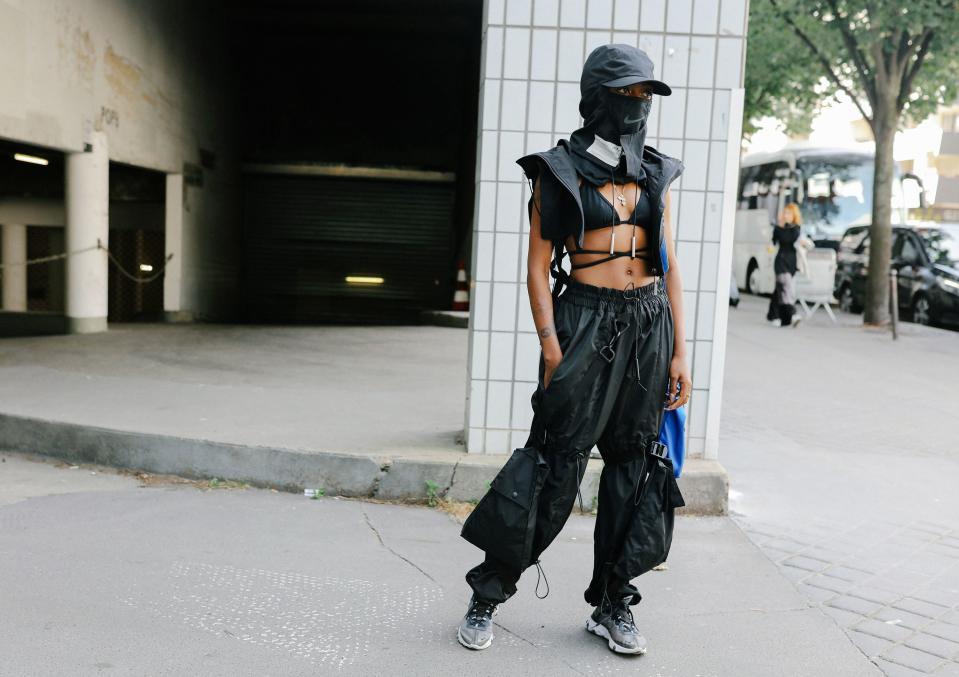 Tactical clothes are trending, from Louis Vuitton to Alyx. We're tracing the trend back to Helmut Lang, Raf Simons, and our troubled times.