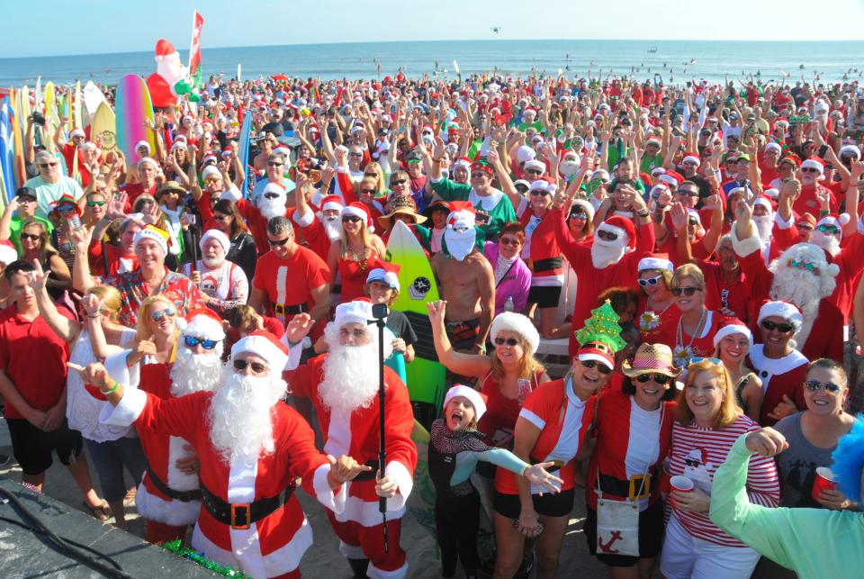 Hundreds of Surfing Santas will take to the waves on Christmas Eve morning in front of Coconuts on the Beach in Cocoa Beach.