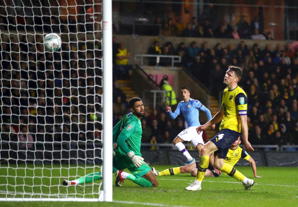 OXFORD, ENGLAND - DECEMBER 18: Joao Cancelo of Manchester City scores his team's first goal  during the Carabao Cup Quarter Final match between Oxford United and Manchester City at Kassam Stadium on December 18, 2019 in Oxford, England. (Photo by Julian Finney/Getty Images)