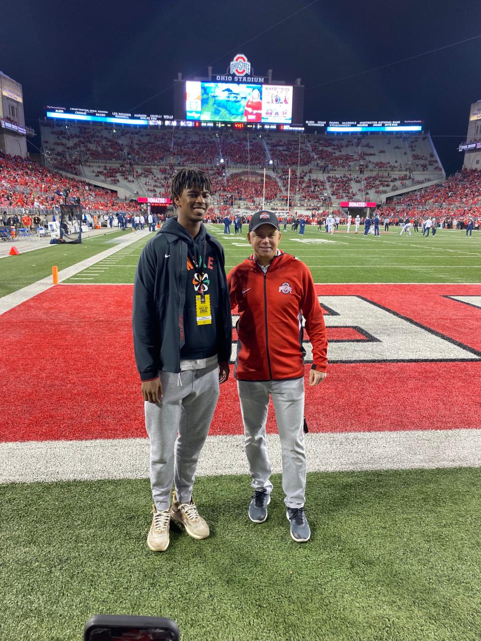 Windemere, Florida, power forward Sean Stewart poses for a photo with Ohio State men's basketball coach Chris Holtmann while on an official visit at the football game at Ohio Stadium on October 30, 2021.