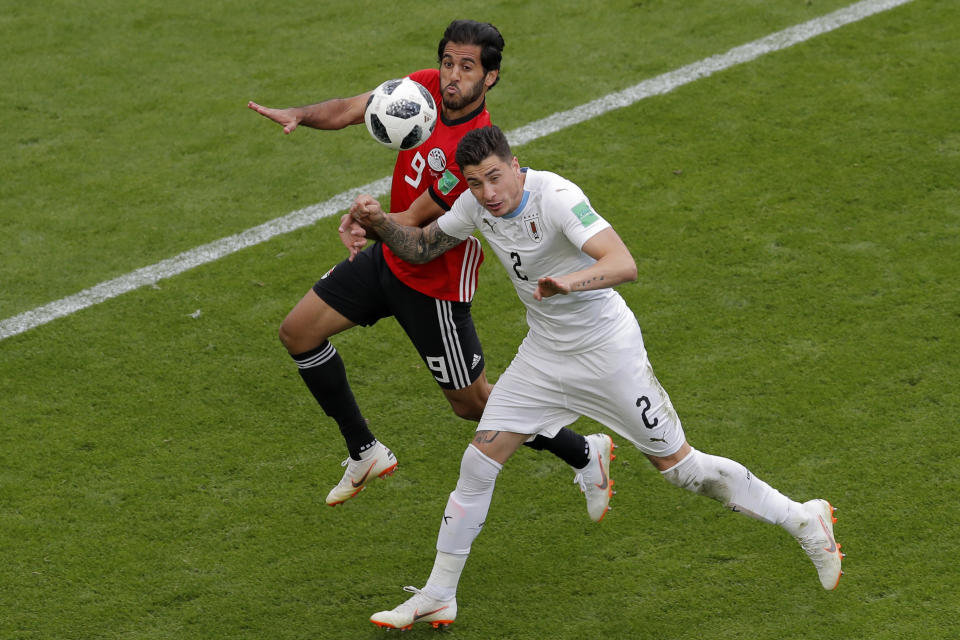 <p>Uruguay’s Jose Gimenez, right, jumps for the ball with Egypt’s Marwan Mohsen during a goalless first half. (AP Photo/Vadim Ghirda) </p>