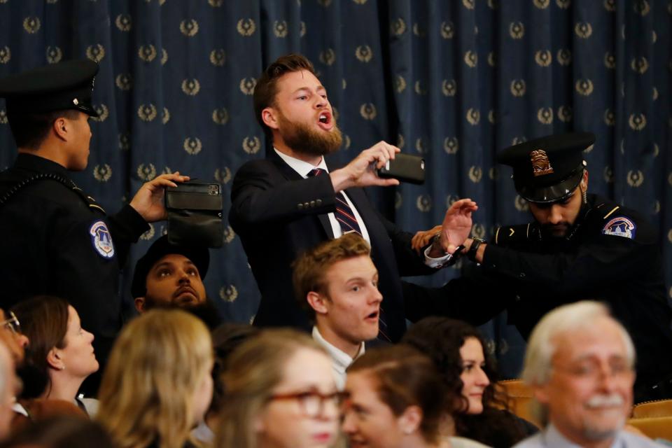 Owen Shroyer, an Infowars host, disrupts the beginning of a House Judiciary Committee impeachment hearing before being removed from police: AP