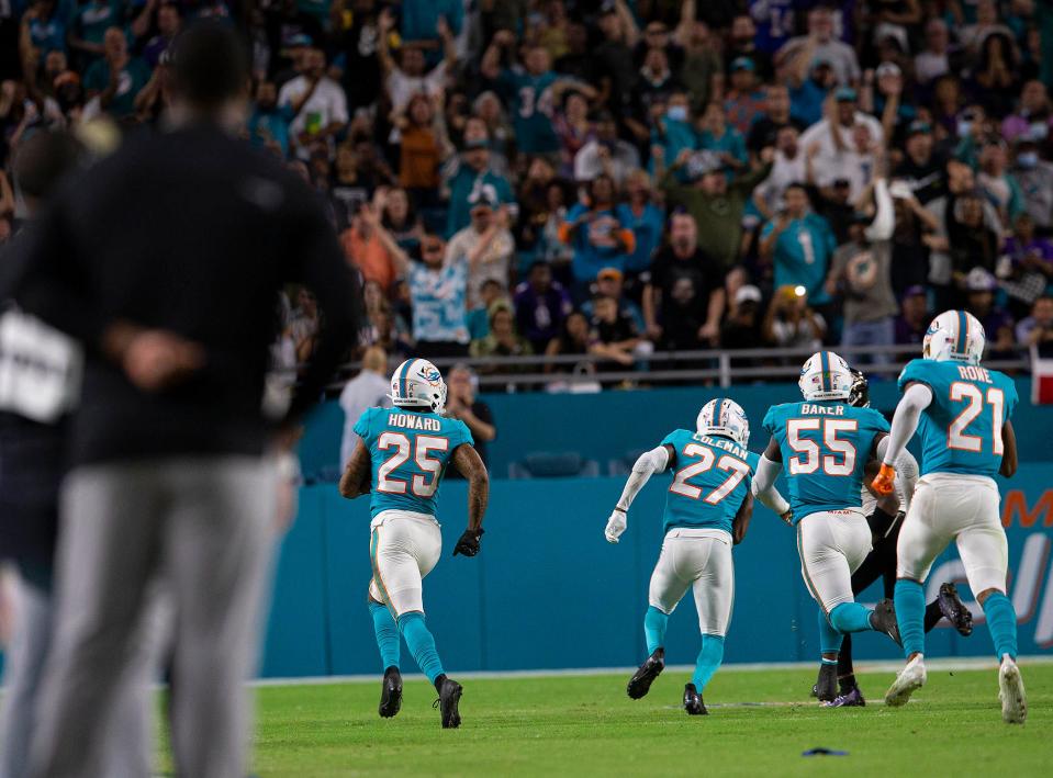 Miami Dolphins cornerback Xavien Howard (25), runs a fumble recovery for a touchdown late in the fourth quarter against the Baltimore Ravens during NFL game at Hard Rock Stadium Thursday in Miami Gardens. 