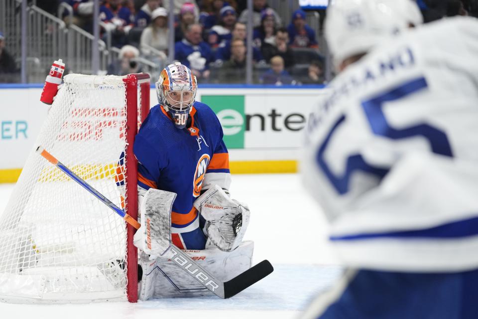 New York Islanders goaltender Ilya Sorokin (30) protects his net from Toronto Maple Leafs' Mark Giordano (55) during the first period of an NHL hockey game Thursday, Jan. 11, 2024, in Elmont, N.Y. (AP Photo/Frank Franklin II)
