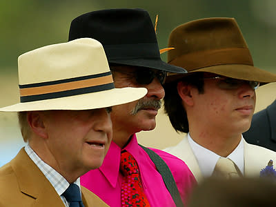 Hot pink shirt with suspenders and a fedora were all the rage at the Victoria Derby day in 2002.