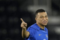 France's Kylian Mbappe gestures during a training session at the Jassim Bin Hamad stadium in Doha, Qatar, Thursday, Dec. 8, 2022. France will play against England during their World Cup quarter-final soccer match on Dec. 10. (AP Photo/Christophe Ena)