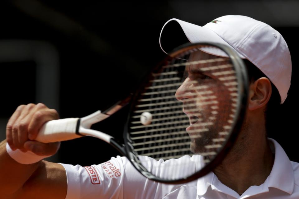 Novak Djokovic, from Serbia, returns the ball to Taylor Fritz, from United States during the Madrid Open tennis tournament in Madrid, Tuesday, May 7, 2019. (AP Photo/Bernat Armangue)