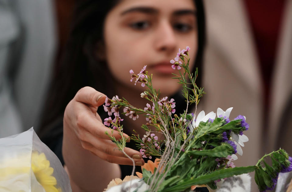 <p>A mourner visits a makeshift memorial a day after a van struck multiple people along a major intersection in north Toronto, Ontario, Canada, April 24, 2018. (Photo: Carlo Allegri/Reuters) </p>