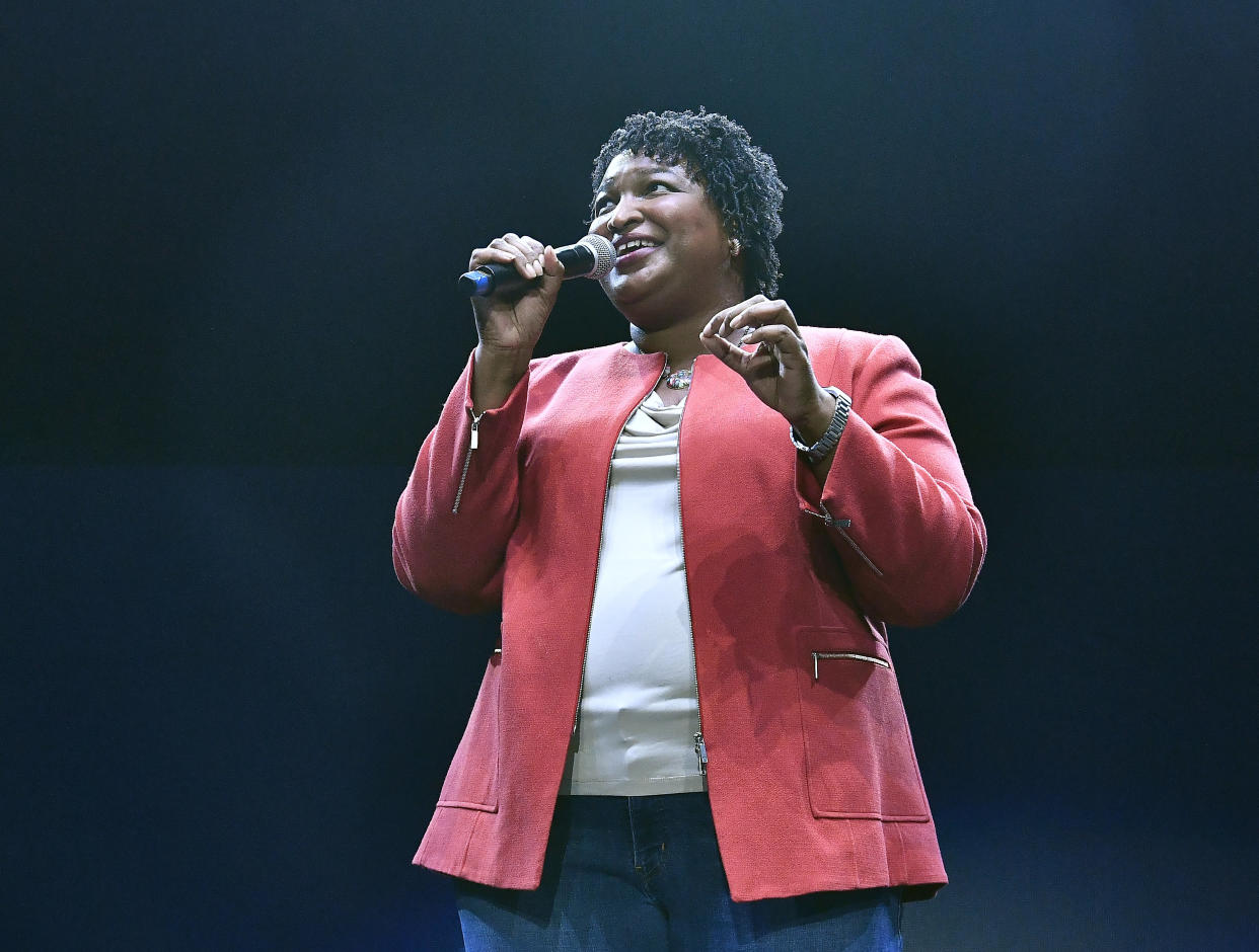 The ACLU's ad seeks to remind voters of Stacey Abrams' work with popular GOP Gov. Nathan Deal. (Photo: Paras Griffin via Getty Images)