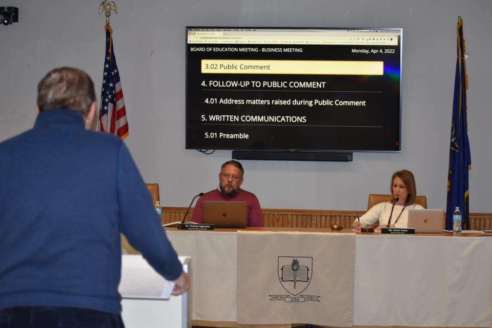 Scarsdale resident Bob Harrison, left, said Superintendent of School Thomas Hagerman, center, should resign for failing to inform the school board  in a timely manner about $1.7 million in IRS fines.