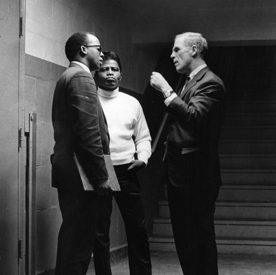 City Councilor Thomas Atkins, left, and Boston Mayor Kevin White backstage with James Brown - Getty