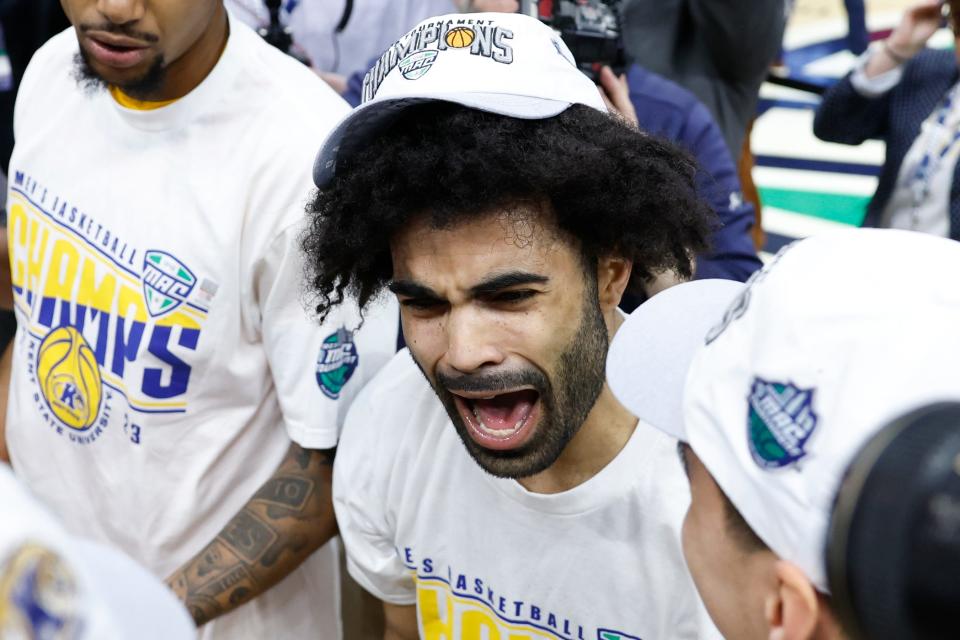 Kent State guard Sincere Carry celebrates after defeating Toledo in an NCAA college basketball game to win the championship of the Mid-American Conference Tournament, Saturday, March 11, 2023, in Cleveland. (AP Photo/Ron Schwane)