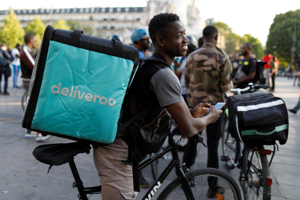 A biker, wearing a Deliveroo food courier backpack, demonstrates during a call on clients to boycott the brand in Paris, France, August 7, 2019.  REUTERS/Charles Platiau