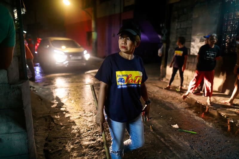 Lea Reyes Cabrera, 51, a member of a volunteer group of women patrollers, is photographed while on duty in Pateros