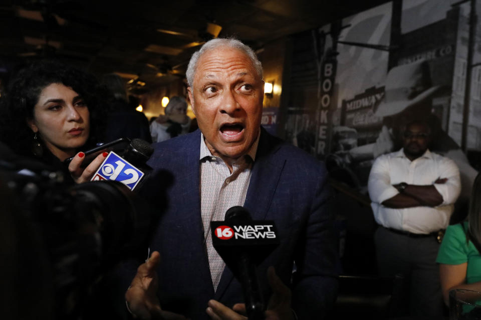 Mike Espy speaks to reporters in Jackson, Miss., after winning the Democratic nomination for a U.S. Senate seat in Mississippi, Tuesday, March 10, 2020. After his victory Tuesday, he will face Republican incumbent U.S. Sen. Cindy Hyde-Smith and Libertarian candidate Jimmy Edwards in November. (AP Photo/Rogelio V. Solis)