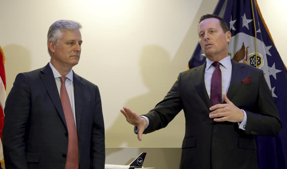 Robert C. O'Brien, left, United States National Security Advisor, and Richard Grenell, right, United States Ambassador to Germany, address the media during a press conference in Berlin, Germany, Monday, Jan. 20, 2020 prior to the signing of an agreement between Kosovo and Serbia, establishing air service between the two capitals. (AP Photo/Michael Sohn)