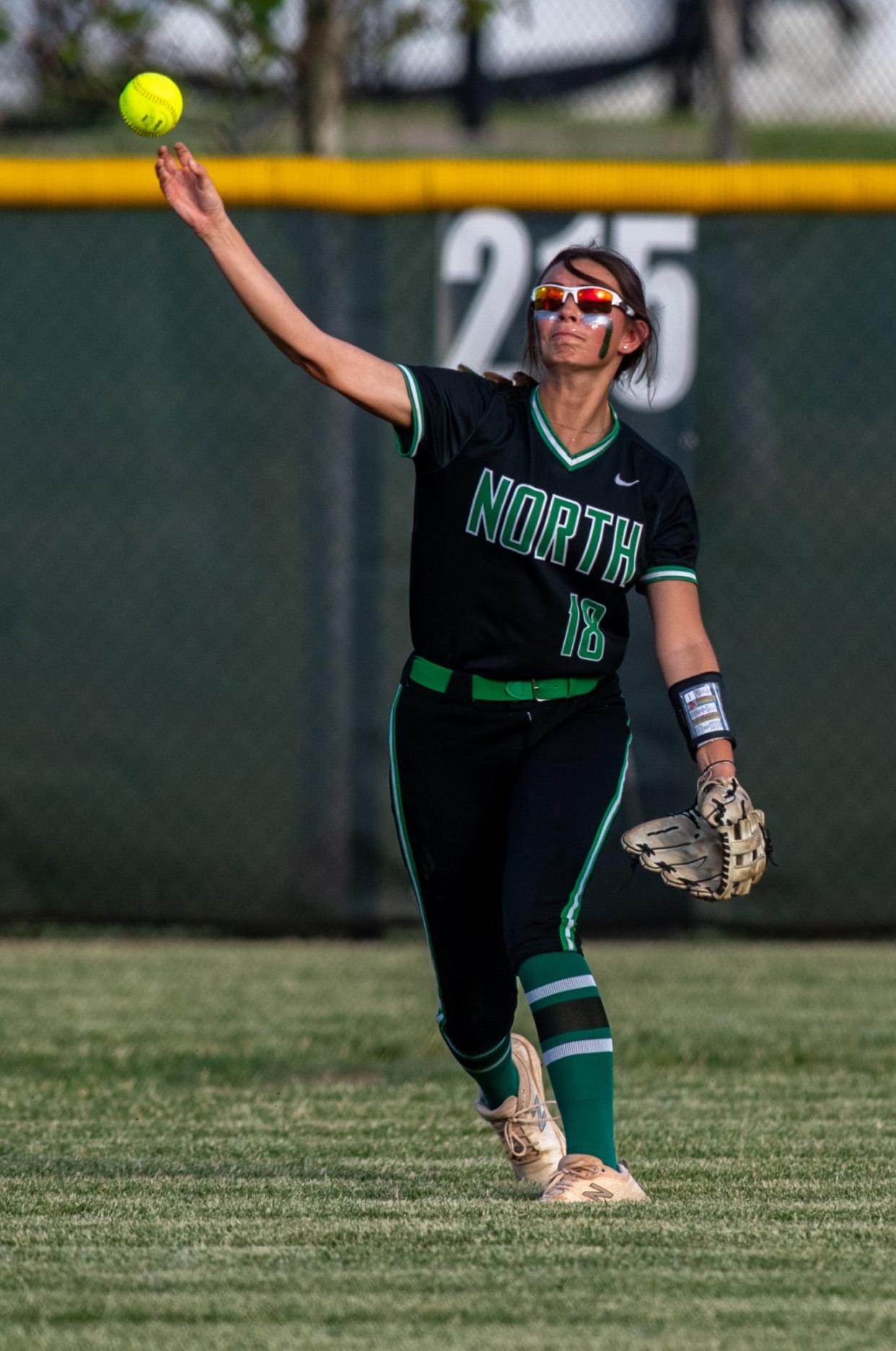 North’s Allie Joiner (18) throws the ball back to the infield as the Huskies play the Castle Knights in the 4A sectional championship at North High School, Saturday night, May 28, 2023.