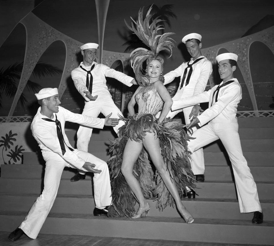 FILE - In this May 20, 1957 file photo, Actress Rhonda Fleming blossoms out as a singer and dancer in the first night club appearance of her career at the New Tropicana hotel in Las Vegas. When the Tropicana Las Vegas opened in 1957, Nevada's lieutenant governor at the time turned the key to open the door on what would become a Sin City landmark for more than six decades. Then he threw away the key. “This was to signify that the Tropicana would always stay open,” said historian Michael Green. Six decades later, the storied hotel-casino that once had ties to the mob and had been nicknamed the “Tiffany of the Strip,” is set to shut its doors for good to make room for a $1.5 billion Major League Baseball stadium. (AP Photo/David Smith, File)