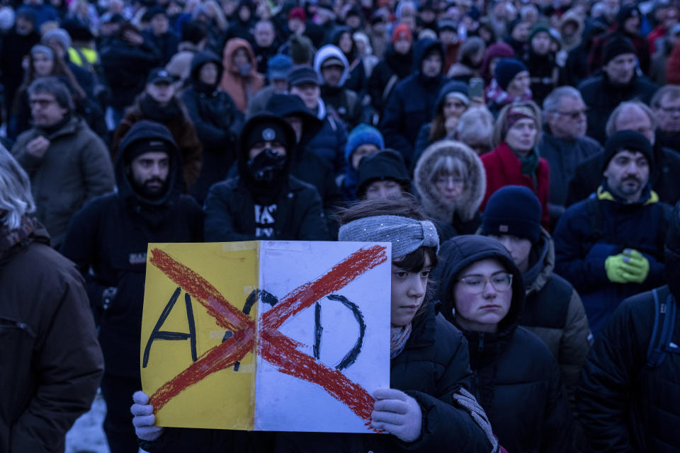 FILE - People gather to protest against the far-right Alternative for Germany, or AfD party, and right-wing extremism in front of the parliament building in Berlin, Germany, Jan. 21, 2024. Millions of Germans have joined rallies all over the country for weeks in a row, attending events with slogans such as "Never Again is Now." The protesters have been alarmed by the AfD's policies and its growing popularity. (AP Photo/Ebrahim Noroozi, File)